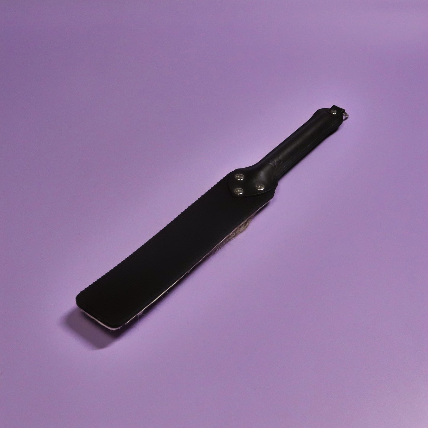 Punishment Paddle - Black Dimpled Rubber & Hair on Hide Reindeer